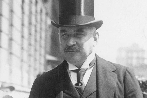 Black and white photograph of JP Morgan wearing a top hat