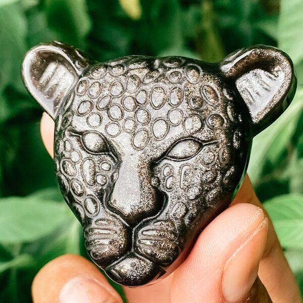 Gold sheen Obsidian carved into a jaguar face