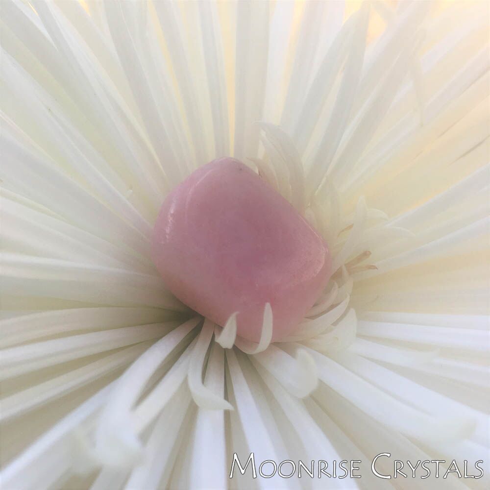 Petalite over a white flower