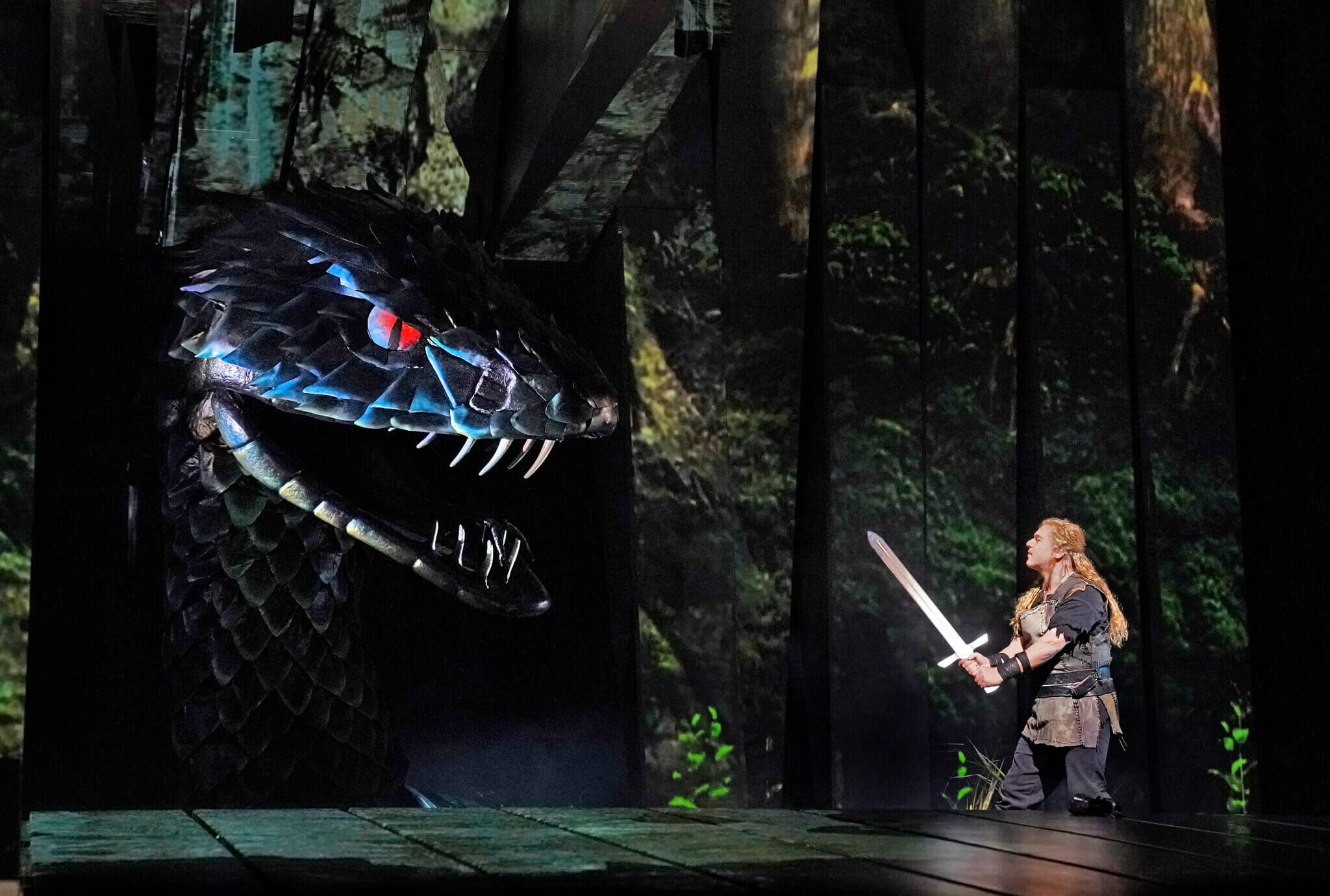 Photograph of scene in Wagner's Ring Cycle Opera, the hero Siegfried prepares to fight the Dragon