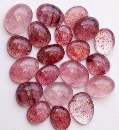 Polished Strawberry Quartz. The sparkles are not uniform in size and distribution, so it's sparkle would be considered iridescence rather than aventurescence