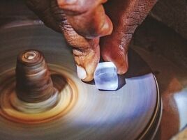 Polishing one stone on a polishing wheel