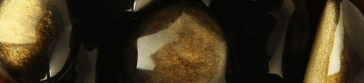 Golden Sheen Obsidian 1200 Close up of tumbled Golden Sheen Obsidian