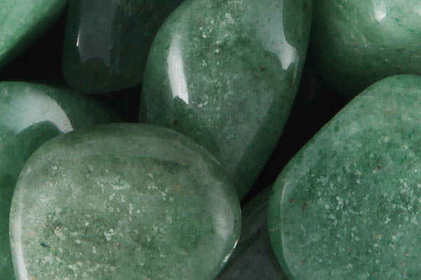 Close up of tumbled Green Aventurine
