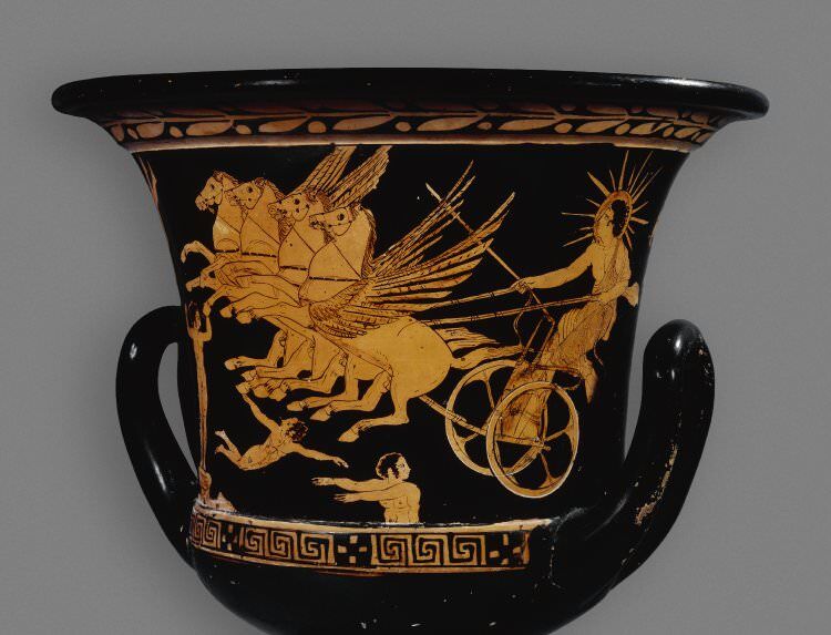 Black pottery painted with an image of Helios the sun god riding his chariot pulled by winged horses