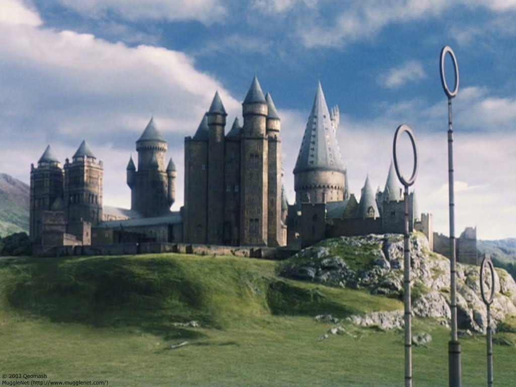 Painting of Hogwarts Castle with quidditch pitch in foreground