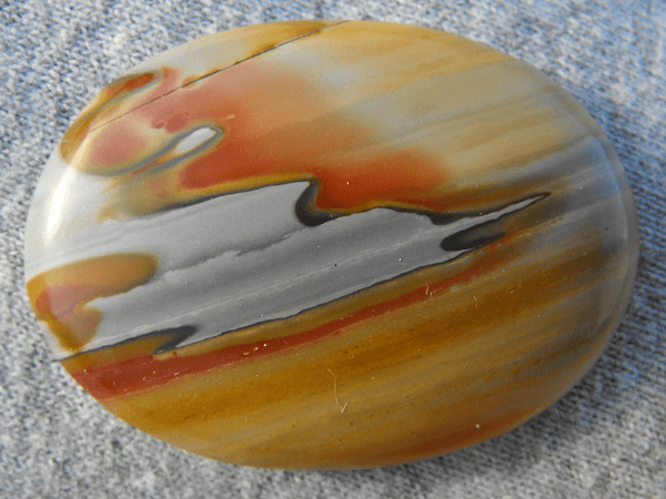 Owyhee Jasper - oval stone that is mostly yellow-orange and white