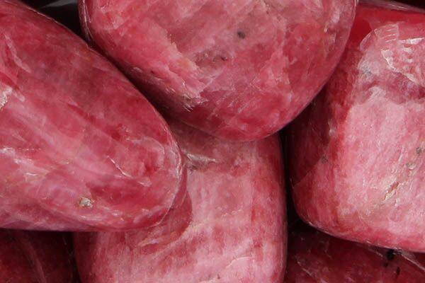Close up of tumbled Rhodonite