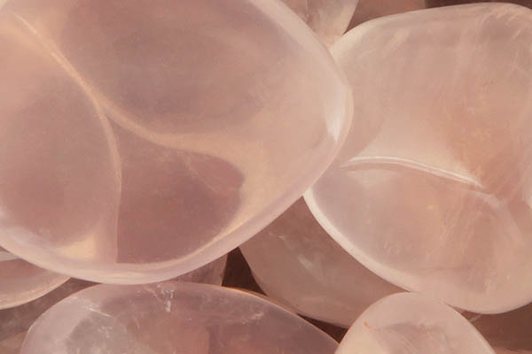 Close up of tumbled Girasol Rose Quartz