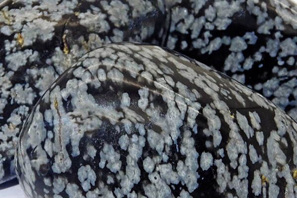 Close up of tumbled Snowflake Obsidian