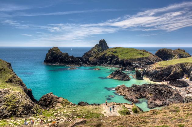 Kynance Cove in Cornwall tropical blue water in a green cove
