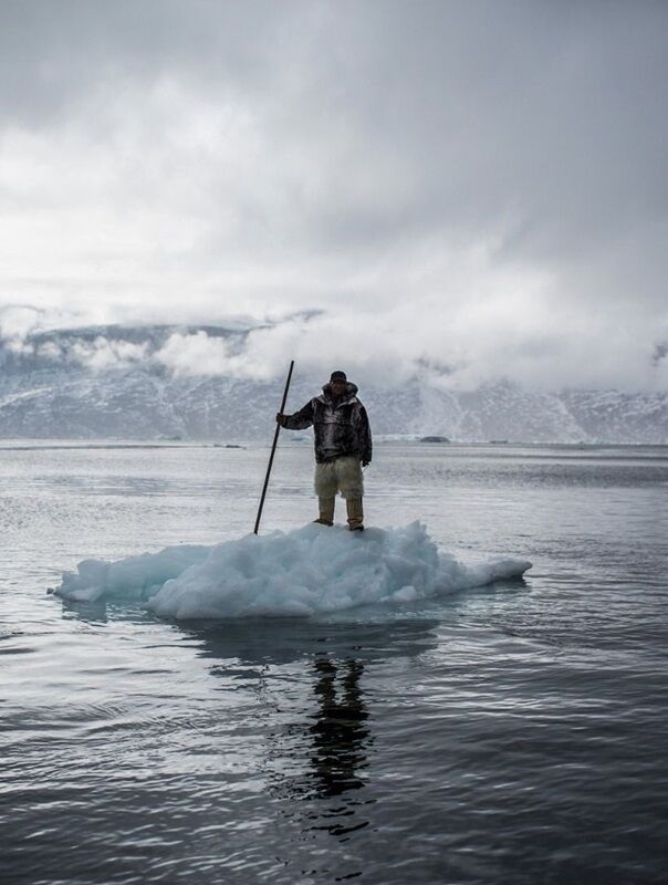 Greenland Hunter 2 Hunter in Greenland standing on a small iceberg