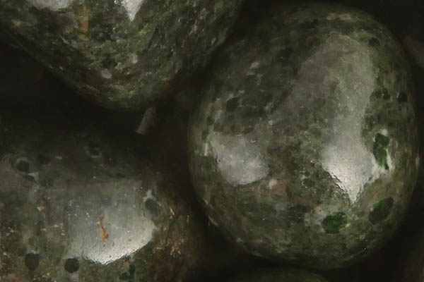 Close up of tumbled Uvarovite Garnet