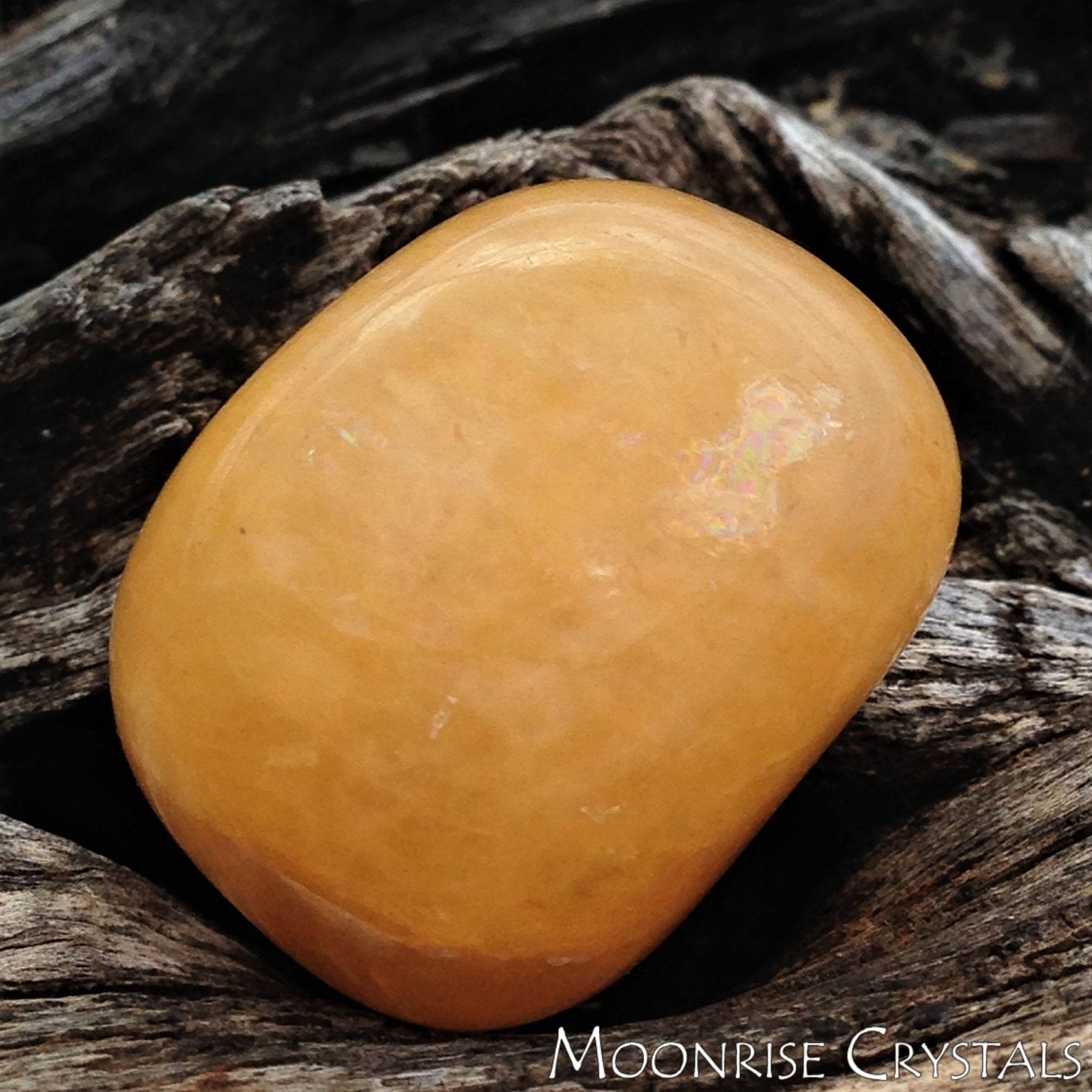 Yellow Aventurine against tree bark