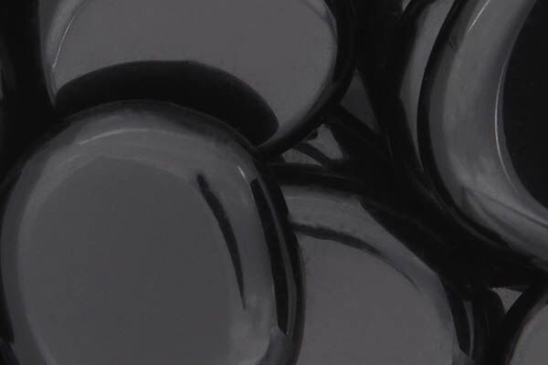 Close up of tumbled Black Obsidian