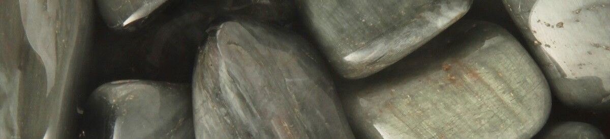 Cat’s Eye – 1200 Close up of tumbled Cat's Eye