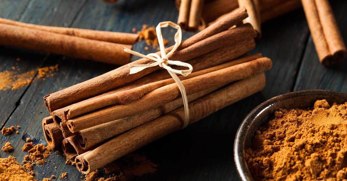 Sticks of Cinnamon and a small bowl of ground cinnamon