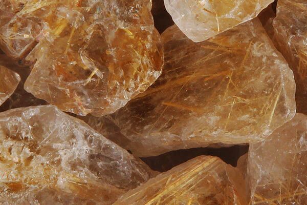 Close up of tumbled Gold Rutilated Quartz