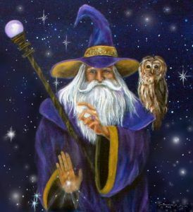 Merlin in a blue robe and hat with an owl on his shoulder