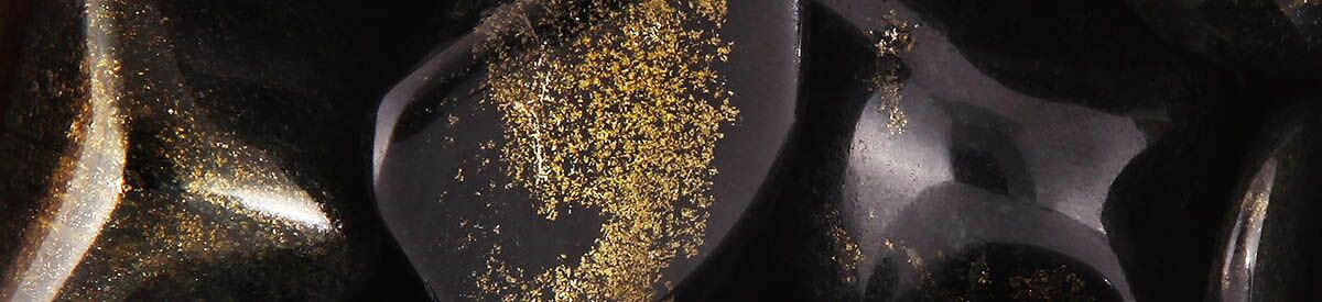 Close up of tumbled Black Jade