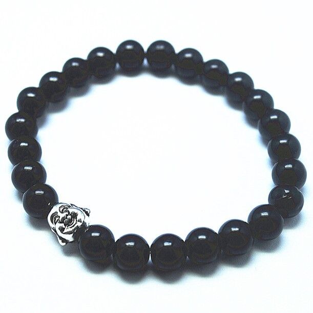 Black Jade beaded bracelet with a silver buddha charm