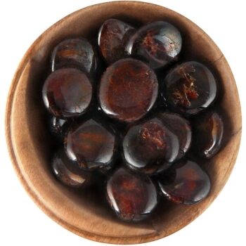Bowl of tumbled Almandine Garnet. Polished discs, dark red
