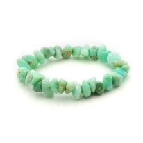 Green Opal chip bracelet on a stretchy string. The beads are irregularly shaped tumbled stones with soft edges. Mostly pastel green but with some brown inclusions