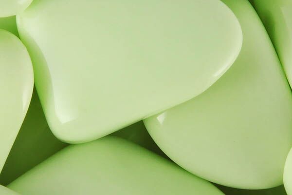 Close up of tumbled Citron Chrysoprase